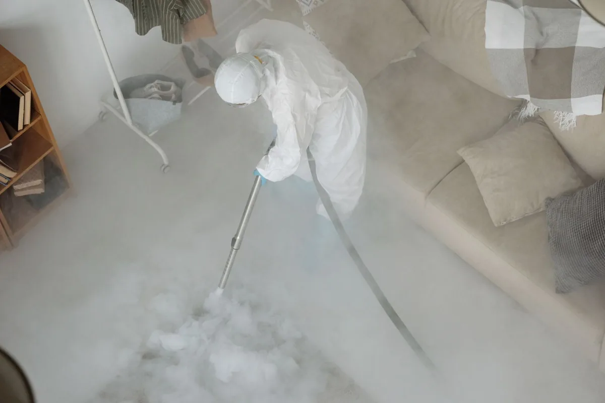 Biohazard cleanup technician in protective equipment, Bradfordville, FL
